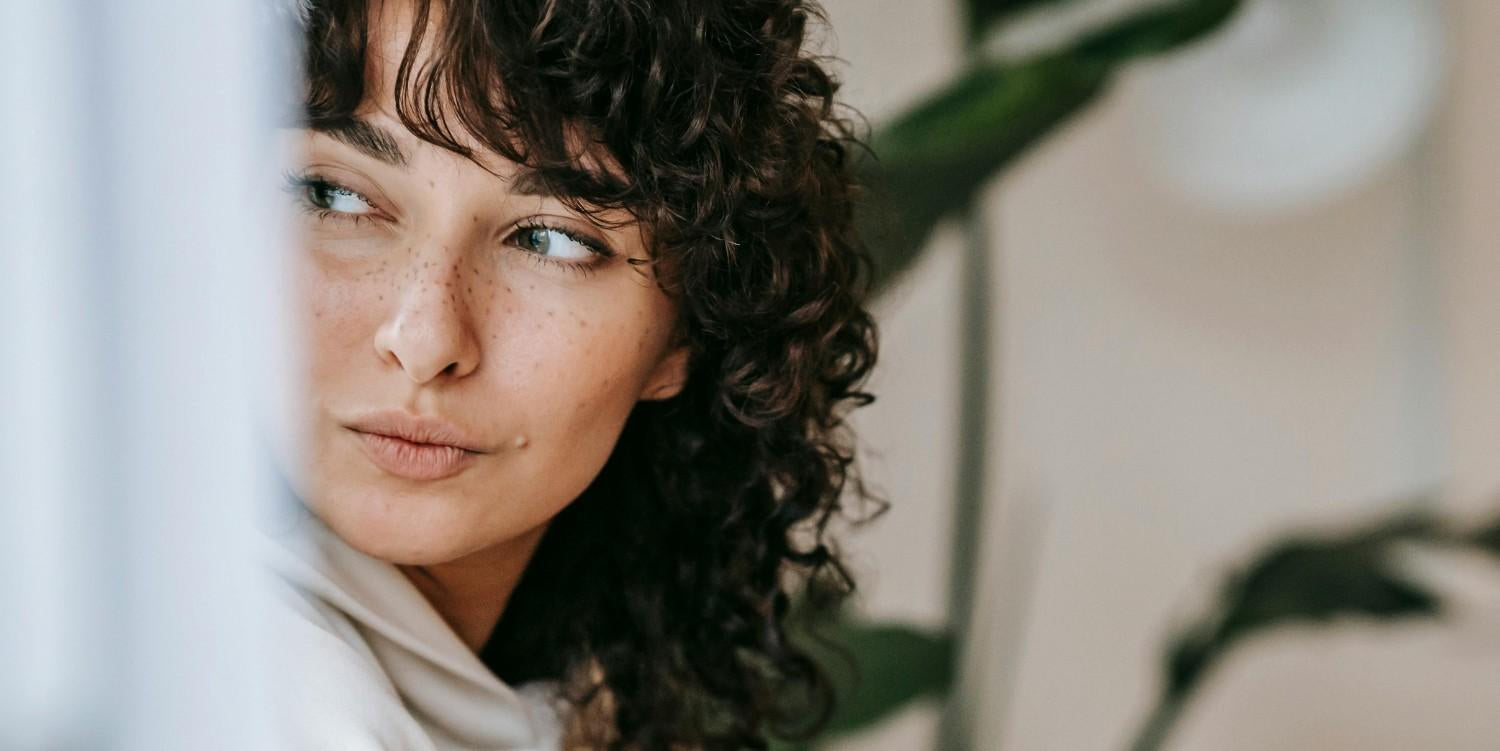 A woman with a shaggy curl.